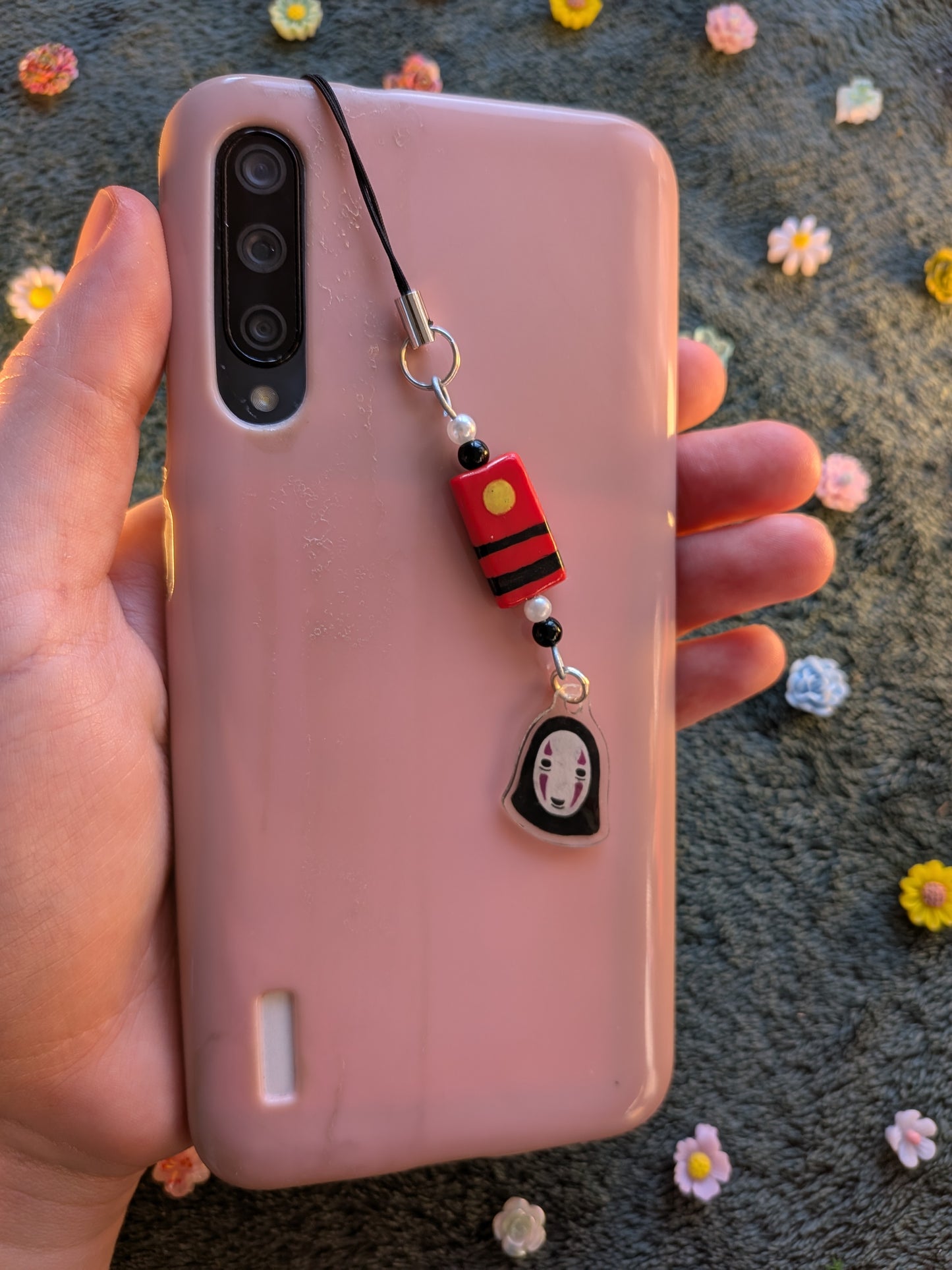 NoFace phone charm