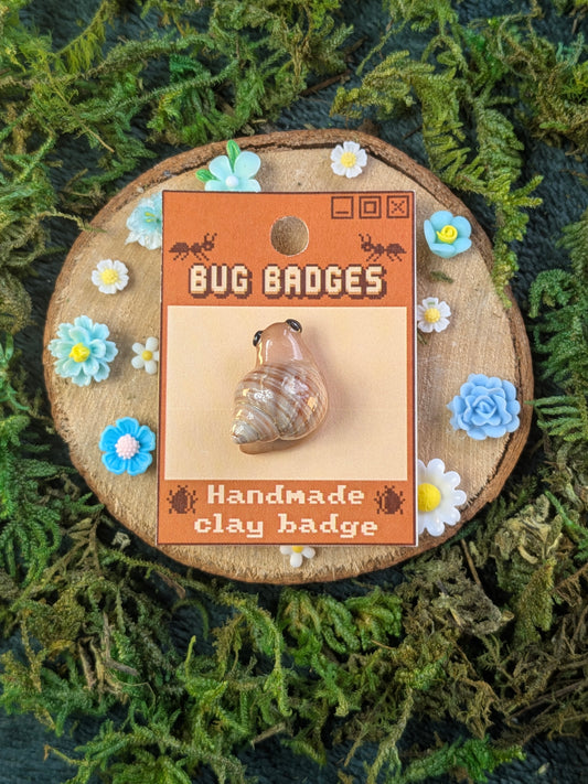 Snail pin badge